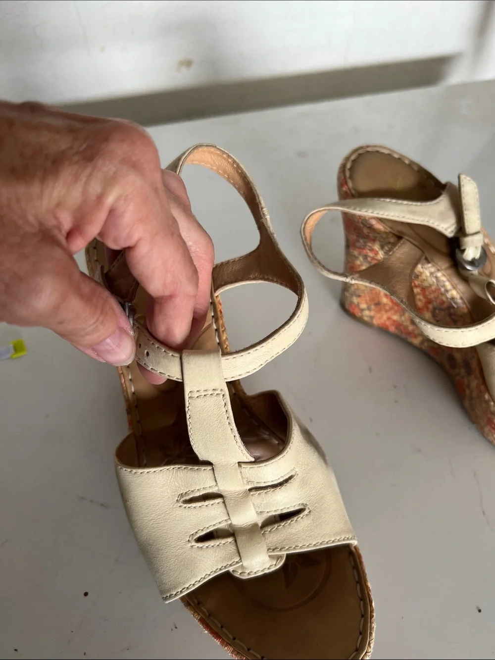 Born Cream Leather Wedge Sandals with a floral wedge.